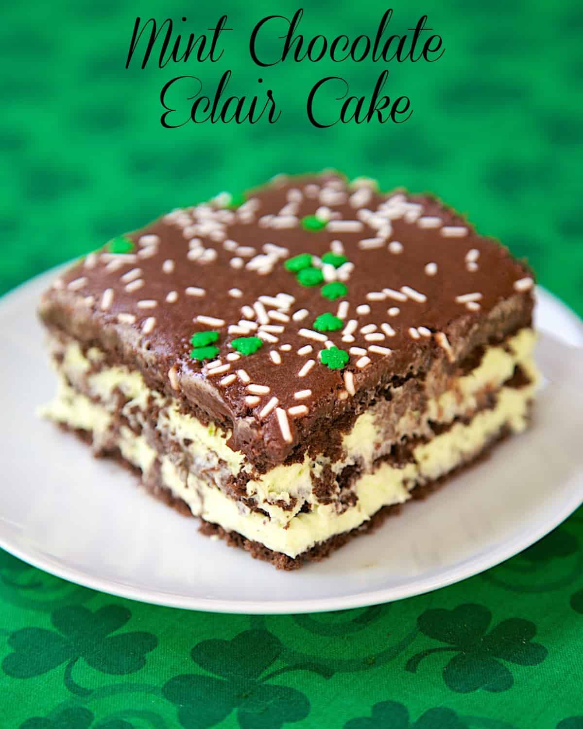 No-Bake Mint Chocolate Eclair Cake - chocolate graham crackers, pudding, cool whip, mint extract and chocolate frosting. Make ahead and refrigerate. Great dessert recipe for a crowd and St. Patrick's Day party!