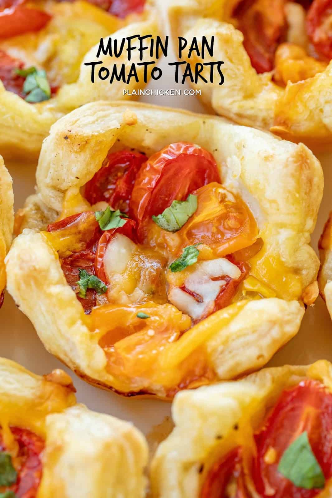 Muffin Pan Tomato Tarts - quick and delicious side dish or appetizer. Multi-colored cherry tomatoes make for a beautiful presentation. Puff pasty, mayonnaise, salt, pepper,  cherry tomatoes, cheddar cheese, mozzarella cheese, basil. Can make ahead and refrigerate until ready to bake. Great for dinner parties! #tomatoes #appetizer #sidedish #tomato #basil