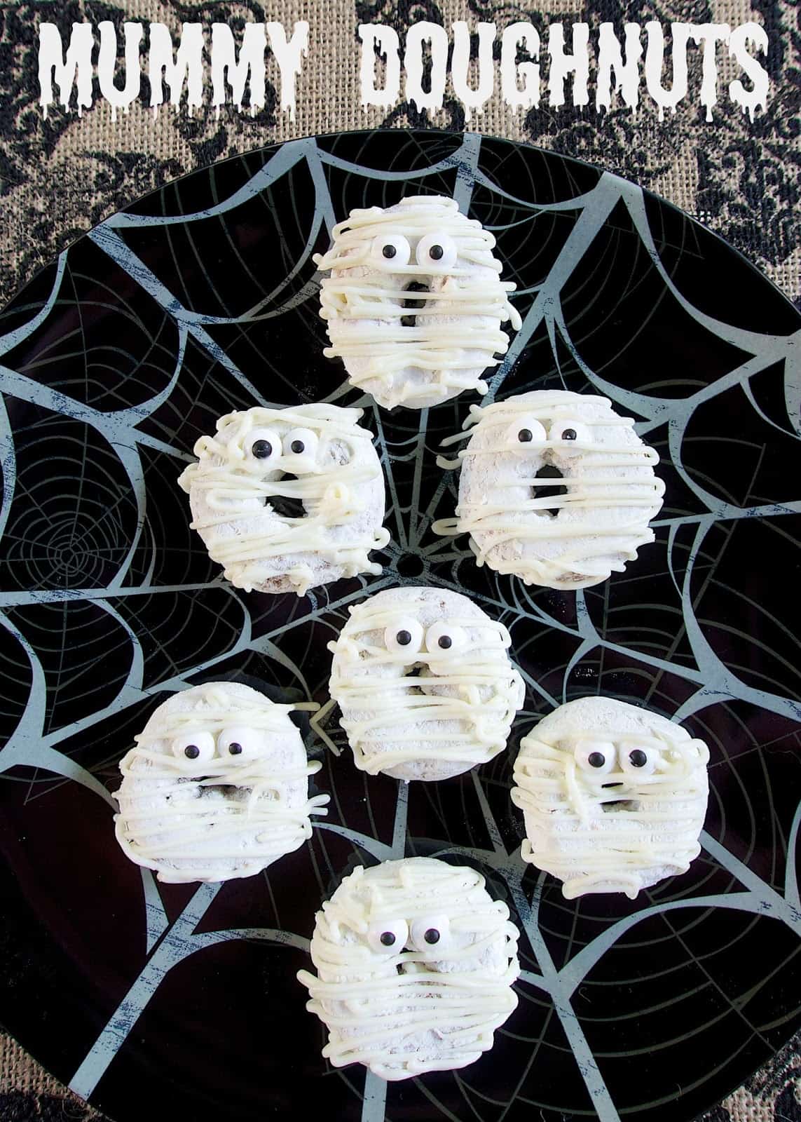 Mummy Doughnuts - doctor up some powdered doughnuts for quick Halloween breakfast idea - also great for classroom parties!