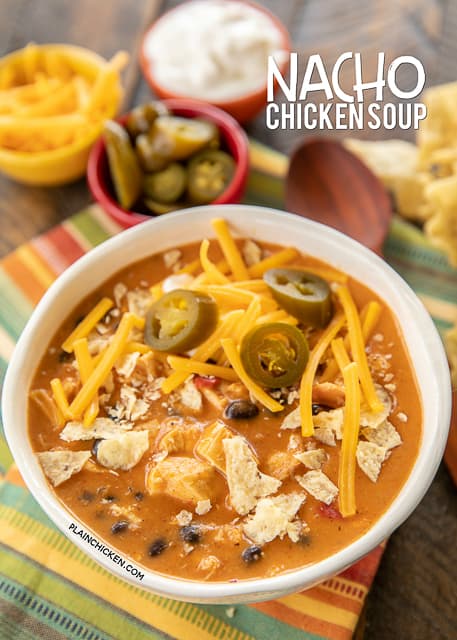 Nacho Chicken Soup - SO good and ready to eat in about 20 minutes. Use a rotisserie chicken for easy prep! Chicken, taco seasoning, nacho cheese soup, milk, black beans and diced tomatoes and green chiles. Top soup with your favorite taco toppings. We ate this twice in one week! SO good!!! #soup #chicken #mexican