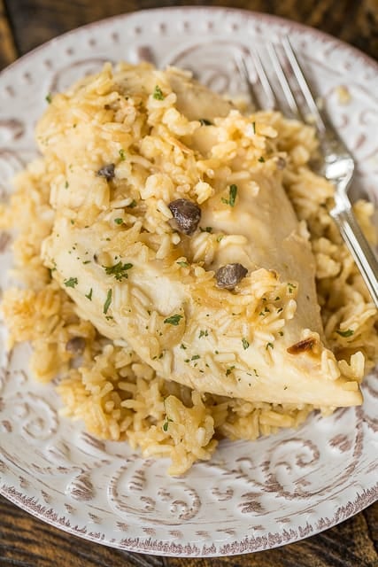 No-Peek Chicken and Rice - super easy dinner recipe! Chicken breasts, rice, cream of chicken soup, cream of mushroom soup, chicken broth, onion soup mix. Mix everything in the baking dish and pop in the oven. SO easy and everyone cleaned their plate! Even our picky eaters!!