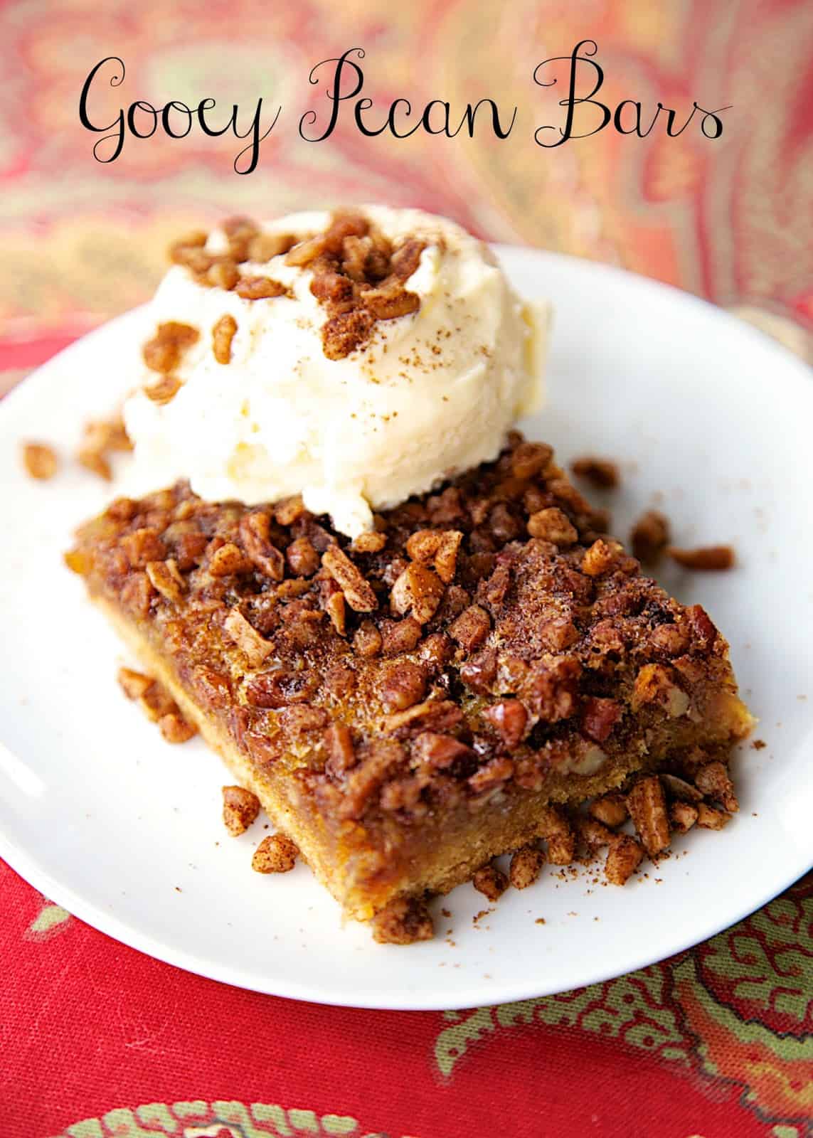 Gooey Pecan Bars - cake mix crust topped with yummy pecan pie filling. Serve warm with ice cream! Perfect for holiday meals! Everyone RAVES about this easy dessert recipe!