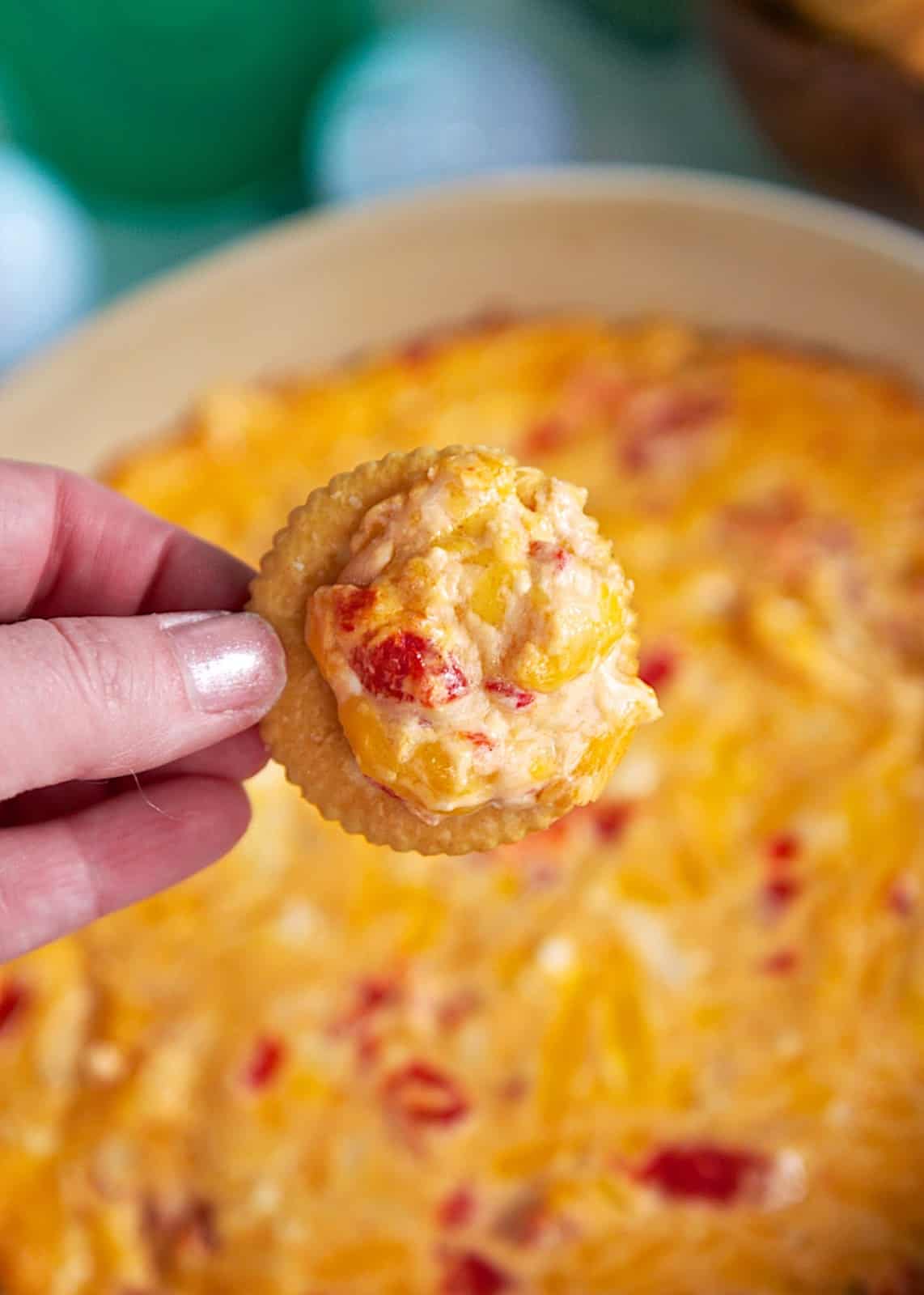 Baked Pimento Cheese Dip Recipe - perfect for The Masters. Cheddar, Parmesan, Roasted Red Peppers, Cream Cheese baked into an ooey, gooey cheesy dip. Great with Ritz cracker, celery or Fritos.