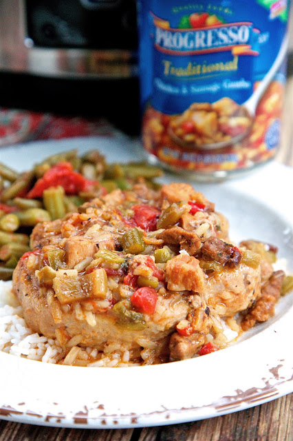 Slow Cooker Gumbo Smothered Pork Chops - pork chops seasoned with cajun seasoning and slow cooked in Progresso™ Chicken and Sausage Gumbo. SO easy and super delicious!  This was a huge hit in our house!