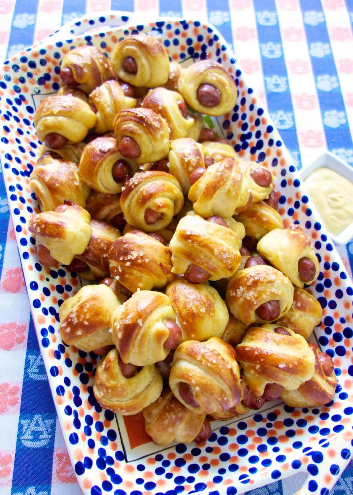 Pretzel Pigs in a Blanket - transform refrigerated crescent rolls into a delicious snack! These are SO easy and SO addictive! You can't eat just one! Great for parties and tailgating. Everyone LOVES this easy appetizer recipe!