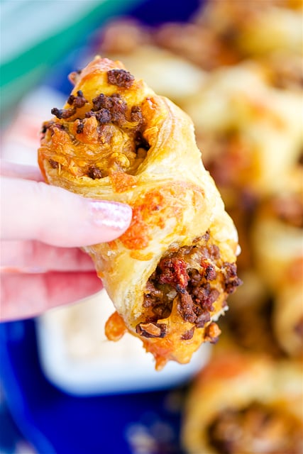 Puffy Tacos - my favorite way to eat tacos! Only 5 ingredients - hamburger, taco seasoning, diced tomatoes and green chiles, cheese and puff pastry. Ready to eat in minutes!! Can make ahead of time and freeze for later. Great for tailgating and parties! 