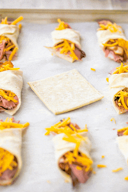 Puffy Club Sandwiches - these were a HUGE hit! Took them to a party and they flew off the plate! Can make ahead of time and freeze for later. Puff pastry topped with honey mustard, ham, turkey, roast beef, bacon and cheddar cheese. I'm going to double the recipe next time. We just love this easy hot sandwich recipe!!