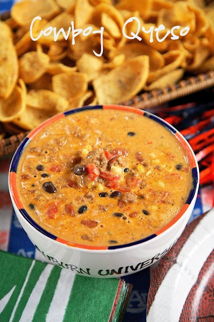 Cowboy Queso Recipe - queso dip loaded with meat, beans, Rotel and corn. Can make in the microwave or slow cooker. Great for tailgating!! I love this dip! We made it two weeks in a row. Would also be great served over rice. YUM!