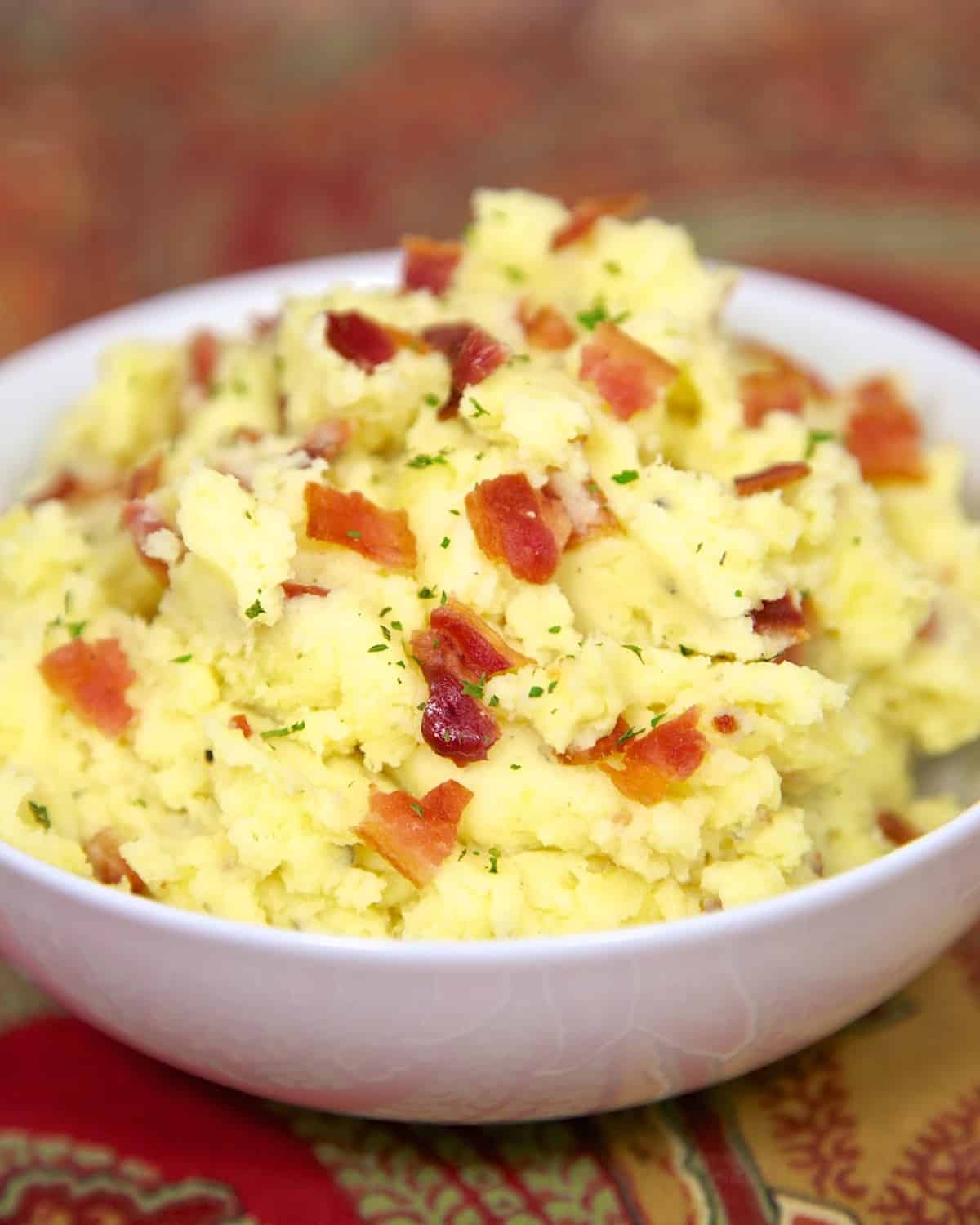 Ranch Mashed Potatoes - yukon gold potatoes, butter, Ranch dressing and bacon. Super quick side dish that packs tons of flavor!