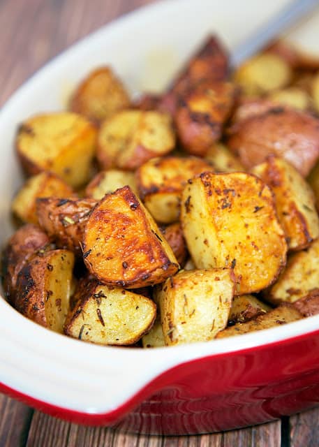 Savory Roasted Red Potatoes Recipe - red potatoes tossed in oil, rosemary, Worcestershire, garlic, paprika and baked. Seriously delicious. Great with chicken, beef and pork. We like them with a juicy burger instead of fries. We make these potatoes at least once a week!