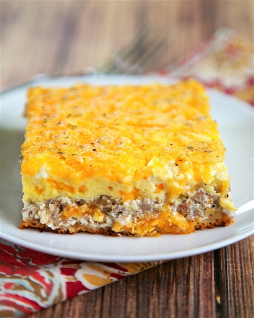 Sausage and Cream Cheese Breakfast Casserole - only 6 ingredients! crescent rolls topped with a mixture of sausage, cream cheese, cheddar, eggs and milk. This is a great casserole for a work potluck, baby shower brunch, breakfast, lunch, dinner, or any other time you need food! Everyone always asks for the recipe! 