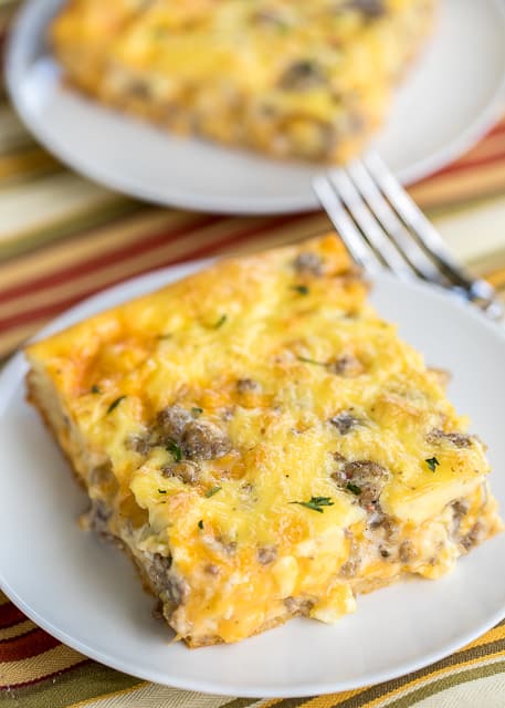 Sausage and Ranch Breakfast Casserole Recipe - CRAZY good!! Crescent rolls topped with eggs, milk, cheddar, sausage and ranch. Ready to eat in about 30 minutes. Great for potlucks, brunch, breakfast, lunch, dinner and tailgates!! Everyone RAVES about this easy breakfast casserole recipe!!! #breakfastrecipe #breakfastcasserole #sausagerecipe #casserole #casserolerecipe