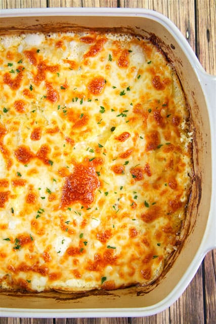 Cheesy Scalloped Potatoes - THE BEST potatoes EVER! Everything cooks in the same pan - easy cleanup! Only 5 ingredients! Potatoes, heavy cream, garlic, parsley, and mozzarella cheese. I could have a made a meal out of these potatoes. I'm still thinking about them! SO good! Easy side dish that is ready in 30 minutes.