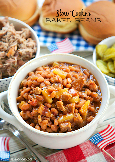 Slow Cooker Baked Beans - absolutely THE BEST baked beans! Bacon, baked beans, onion, mustard, bbq sauce, smoked pork and the secret ingredient - pineapple! SO good! I could make a meal out of these delicious beans! They slow cook all day in the slow cooker. Great for a potluck crowd. Took these to a cookout and everyone asked for the recipe!