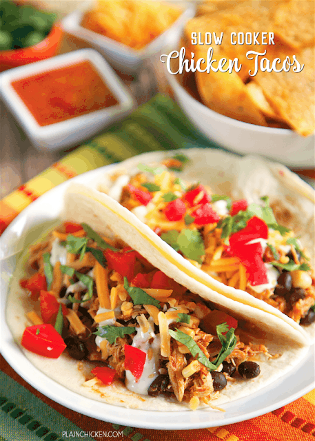 Slow Cooker Chicken Tacos - only 5 ingredients! chicken, salsa, taco seasoning, corn and black beans. Great in taco shells or on top of a salad. We ate this two days in a row! Such a great quick and easy Mexican recipe! The whole family loved it!