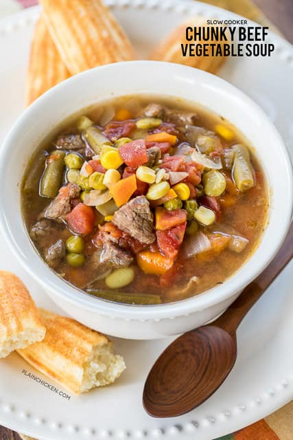 Slow Cooker Chunky Beef Vegetable Soup - seriously delicious! Stew meat, green beans, corn, lima beans, green peas, carrots, celery, onions and diced tomatoes slow cook all day long for an easy and delicious meal! Makes a ton! Freeze leftovers for later. Great for cool Fall and Winter nights! Everyone LOVES this easy slow cooker recipe.