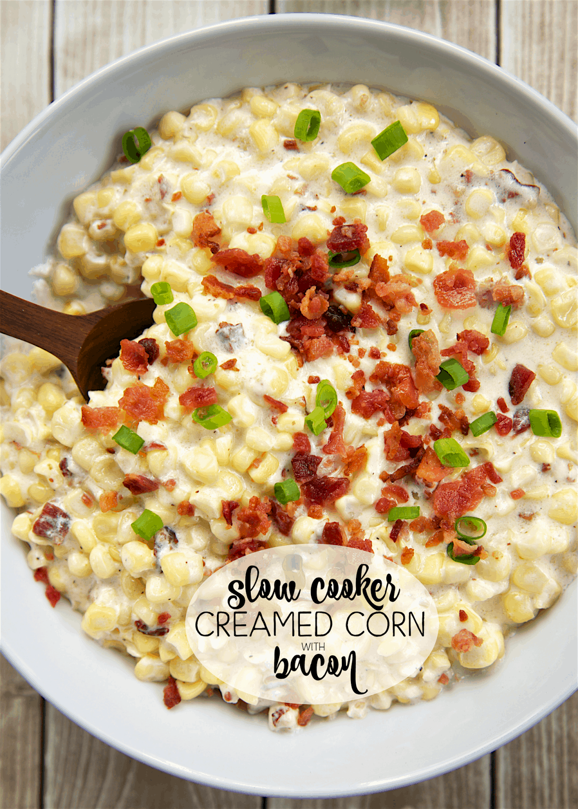 Slow Cooker Creamed Corn with Bacon - Corn, cream cheese, heavy cream, milk, bacon and green onions. YUM! It is super creamy with a hint of smokiness from the bacon. This recipe makes a lot and would be great for a potluck. This is seriously THE BEST corn recipe! I could have made a meal out of this! SO good!