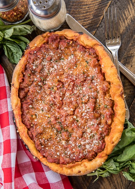 Slow Cooker Deep Dish Pizza - seriously delicious! Fresh pizza dough topped with mozzarella, homemade meat sauce and your favorite toppings. You'll be amazed at how easy it is to put together and how delicious it comes out #pizza #chicagostylepizza #deepdishpizza #slowcooker