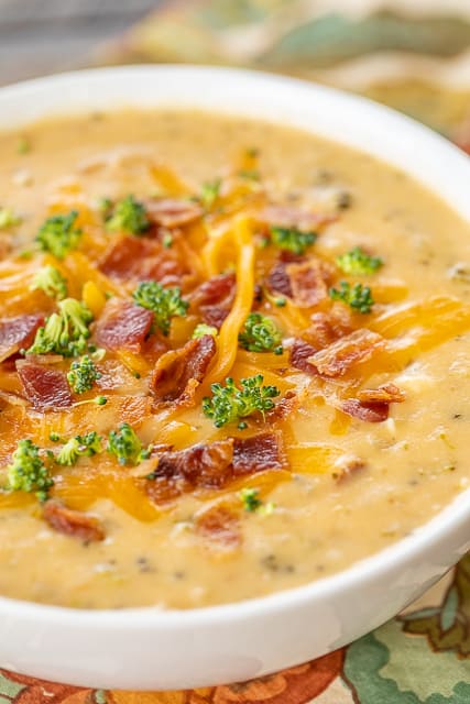 Slow Cooker Crack Potato and Broccoli Cheese Soup - this soup should come with a warning label! SO good! LOADED with cheddar, bacon and ranch!! Everyone went back for seconds! Potatoes, cream of broccoli cheese soup, broccoli, cream cheese, chicken broth, cheddar, bacon and ranch. So simple to make. Just dump everything in the slow cooker and dinner is done! #crockpot #slowcooker #bacon #soup #broccolicheese #potatoes