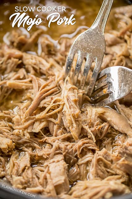 Slow Cooker MOJO Pork - pork shoulder slow cooked in garlic, cumin, oregano, orange juice and lime juice. SO good!!! Serve in tortillas or a bowl with rice, beans and your favorite taco toppings. Freeze the leftover pork for a quick meal later!! So much amazing flavor in this easy dinner! #slowcooker #pork #tacos
