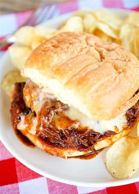 Slow Cooker Texas BBQ Beef Sandwiches - only 3 ingredients! Seriously delicious!! Serve beef on top of hamburger buns with a slice of cheese. Great for potlucks! We love this easy slow cooker beef recipe! Can freeze leftovers for a quick meal later!