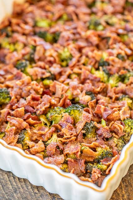Smothered Broccoli - fresh broccoli baked in bacon, brown sugar, butter, soy sauce and garlic. This is the most requested broccoli recipe in our house.Everybody gets seconds. SO good!! Great for a potluck. Everyone asks for the recipe! Super easy to make too! #broccoli #bacon #casserole #recipe