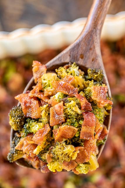 Smothered Broccoli - fresh broccoli baked in bacon, brown sugar, butter, soy sauce and garlic. This is the most requested broccoli recipe in our house.Everybody gets seconds. SO good!! Great for a potluck. Everyone asks for the recipe! Super easy to make too! #broccoli #bacon #casserole #recipe