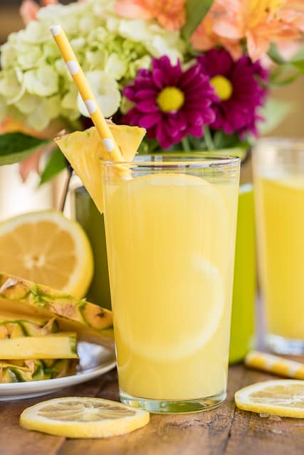 Sparkling Pineapple Lemonade - our signature summer cocktail! Can make with or without alcohol. Lemonade mix, vodka, pineapple juice and sprite. SO easy to make! Super refreshing cocktail for all your summer parties. 