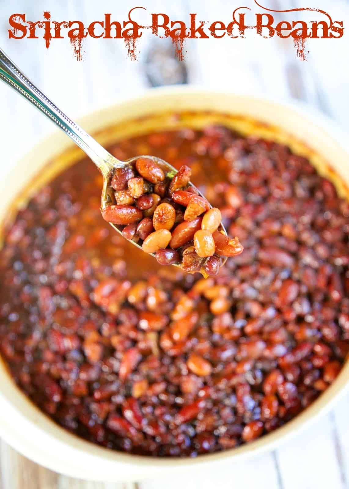Sriracha Baked Beans - smoked sausage, onion, chicken broth, brown sugar, apple cider vinegar Sriracha, molasses, mustard, chili powder, salt, black beans, kidney beans and pinto beans - mix together and bake. Ready in 30 minutes. They are a little sweet and smoky and a lot of delicious! Great side dish for a potluck or cook-out. 