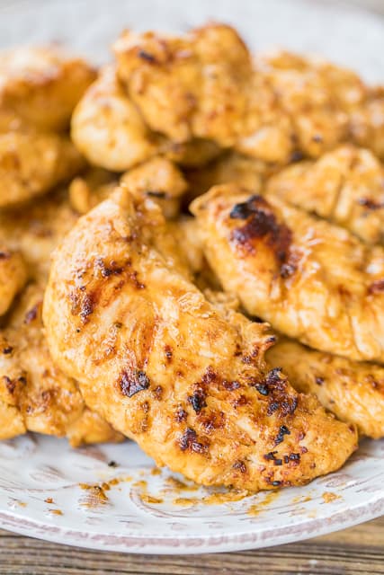 Sweet Heat Chicken - hot sauce and brown sugar marinated chicken that is totally ADDICTING! This is the perfect combination of sweet and spicy! Hot sauce, vinegar, olive oil, onion, garlic, Worcestershire, brown sugar. AMAZING flavor combination! We ate this twice in one week! SO good!