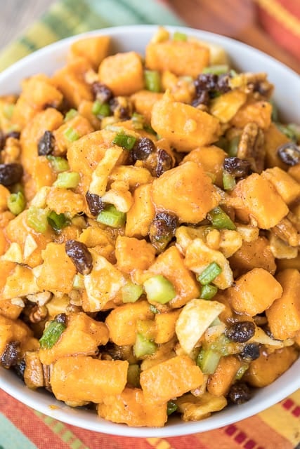 Sweet Potato Salad recipe - an AMAZING side dish!!! Such a great twist on traditional potato salad. Sweet potatoes, apples, pecans, raisins, celery and green onions tossed in a brown sugar, honey, lemon, cinnamon and nutmeg dressing. Everyone RAVES about this dish. Perfect addition to your holiday table! #sweetpotatorecipe #sidedish #thanksgiving #thanksgivingrecipe #christmas #christmasrecipe #sidedishrecipe #sweetpotato