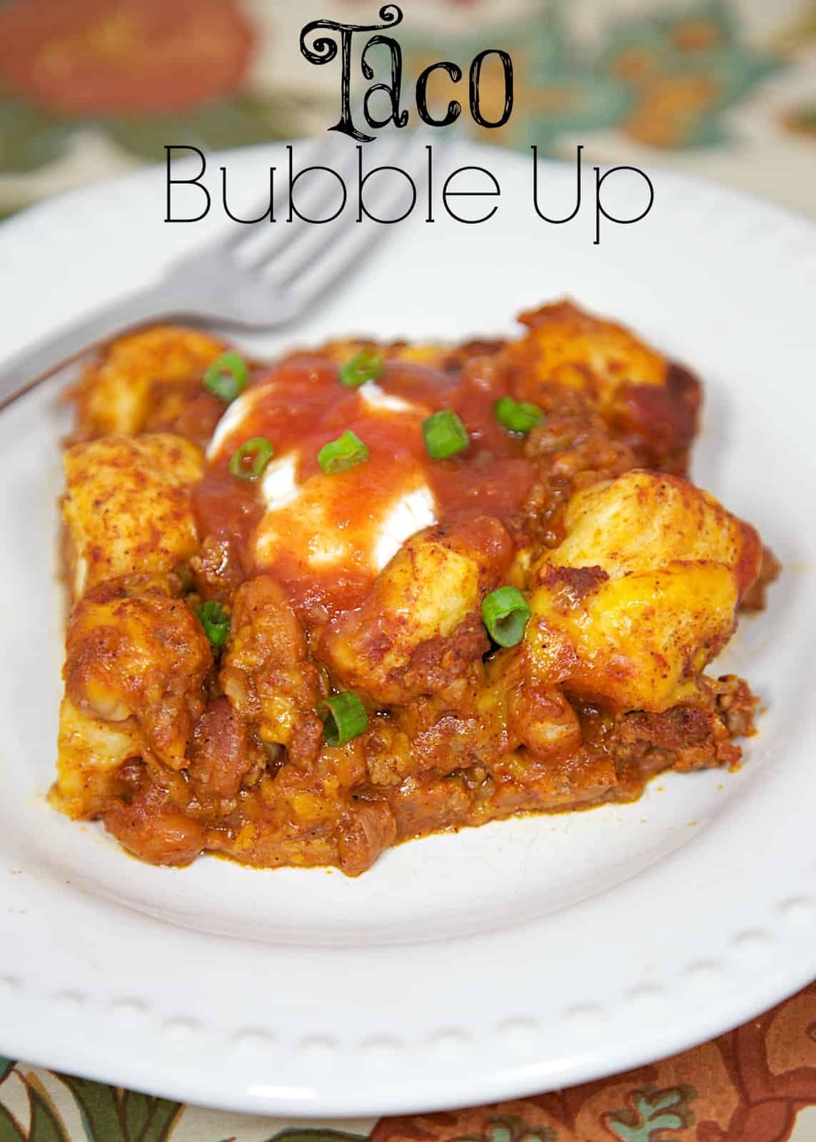 Taco Bubble Up Recipe - taco meat, beans, salsa tossed with refrigerated biscuits - fun twist to taco night! Quick Mexican recipe with everyday ingredients. Top with your favorite taco toppings!!