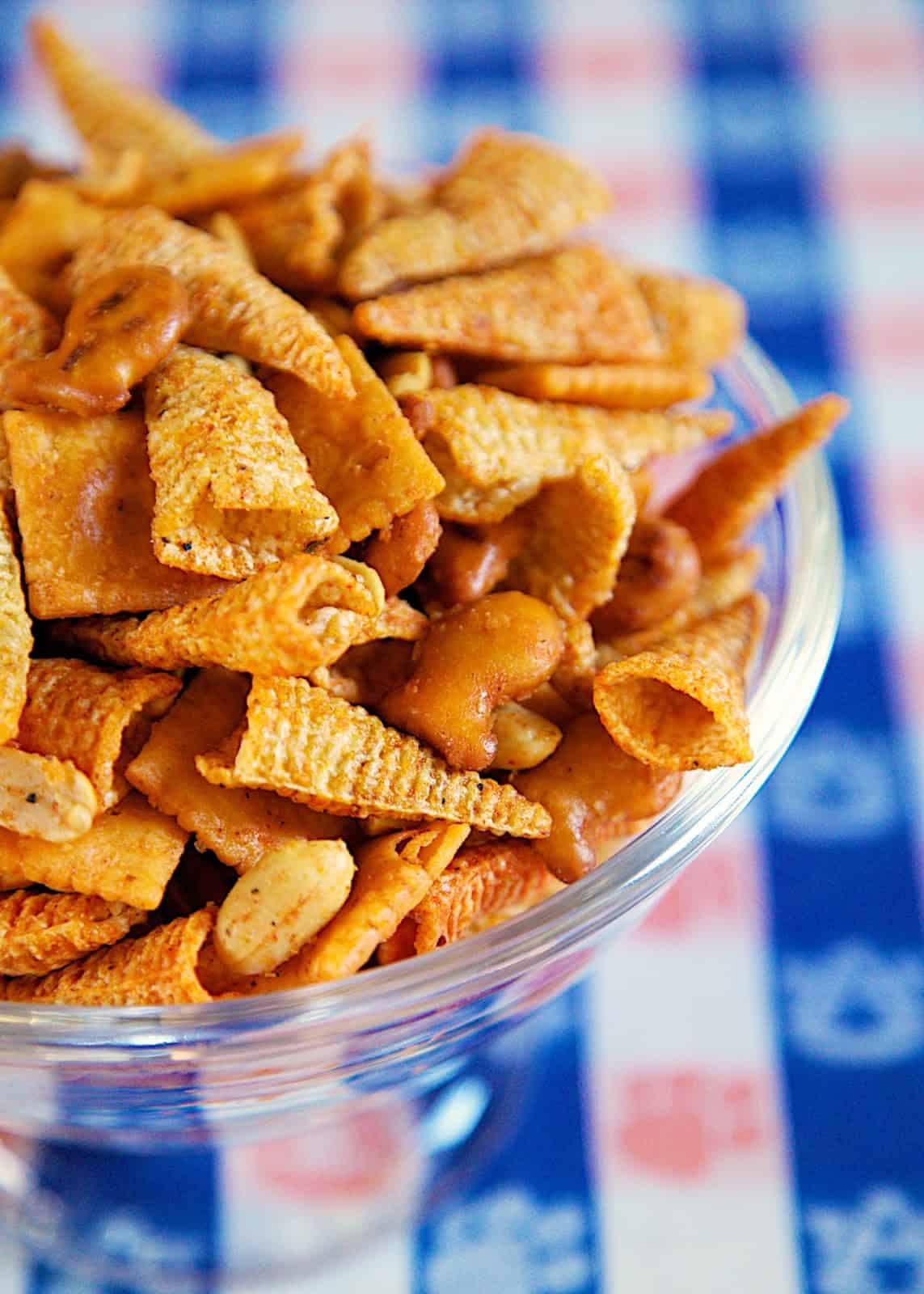 Taco Snack Mix - so addictive!! Bugles, pretzels, cheez-its, peanuts tossed in taco seasoning and oil. Great for snacking on during parties and tailgates!! Everyone RAVES about this yummy snack mix recipe!