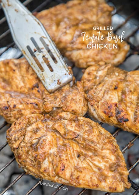 Grilled Tomato Basil Chicken - chicken breast marinated in fresh tomatoes, fresh basil, balsamic vinegar and garlic. This chicken is CRAZY good!!! Great on its own or served on top of pasta. SO much flavor is packed into this easy grilled chicken recipe! Everyone RAVES about this chicken!!