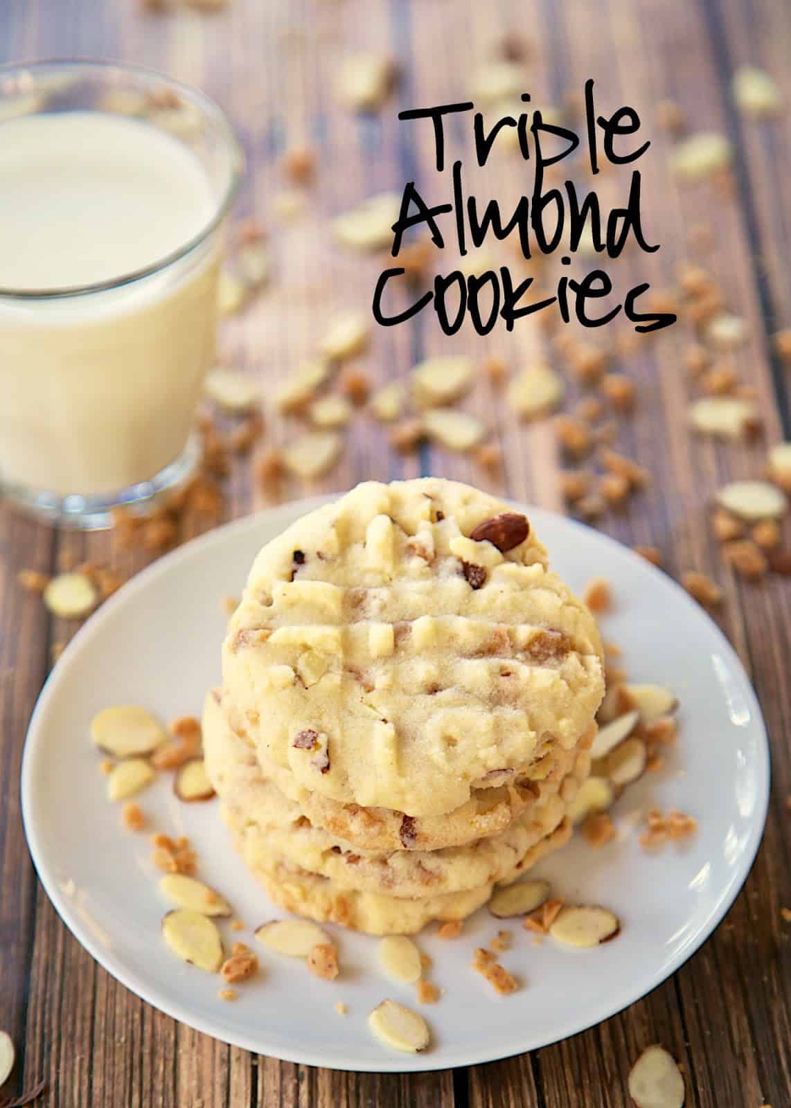 Triple Almond Cookies Recipe - cookies packed with tons of great almond flavor - almond extract, chopped almonds and almond toffee bits! We ate WAY too many of these cookies. Makes a ton. Great for a potluck!