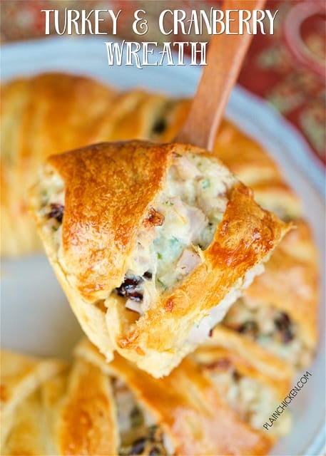 Turkey and Cranberry Wreath - great way to use up leftover turkey. Crescent rolls filled with cooked turkey, mayonnaise, celery, dijon mustard, dried cranberries, swiss cheese and pecans. This is SO good! Can make filling ahead of time and assemble and bake later. Great for parties, brunch, lunch, easy weeknight dinner and tailgating!