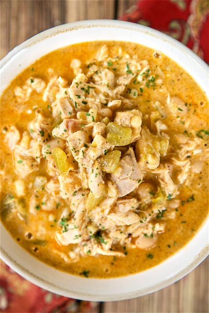 The Ultimate White Chicken Chili - the BEST of the BEST White Chicken Chilis! SO good and ready to eat in under 20 minutes! Rotisserie chicken, white beans, corn, green chilies, chicken broth, onion, garlic, cumin, chili powder, half-and-half, pepper jack cheese. Top with some sour cream and extra cheese. Makes a ton. Freeze leftovers for a quick meal later.