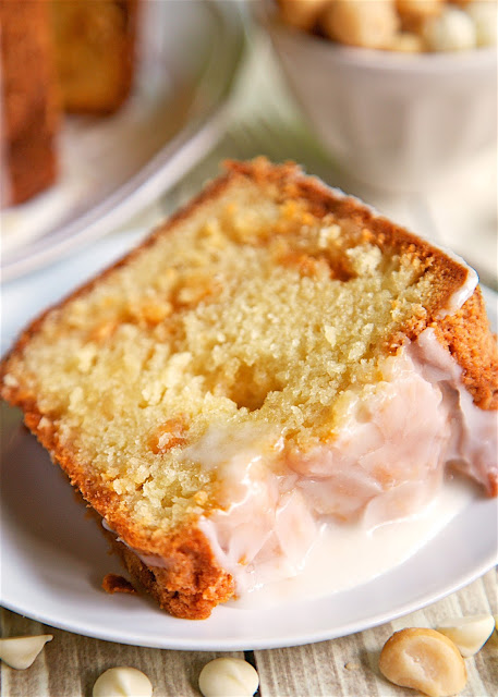 White Chocolate Macadamia Nut Pound Cake - DELICIOUS! An easy from scratch pound cake. Flour, sugar, butter, eggs, vanilla, white chocolate pudding, macadamia nuts, pineapple juice. Cake is drizzled with a quick pineapple glaze. This is CRAZY good!!! This didn't last long in our house! Great for a potluck or homemade gift.