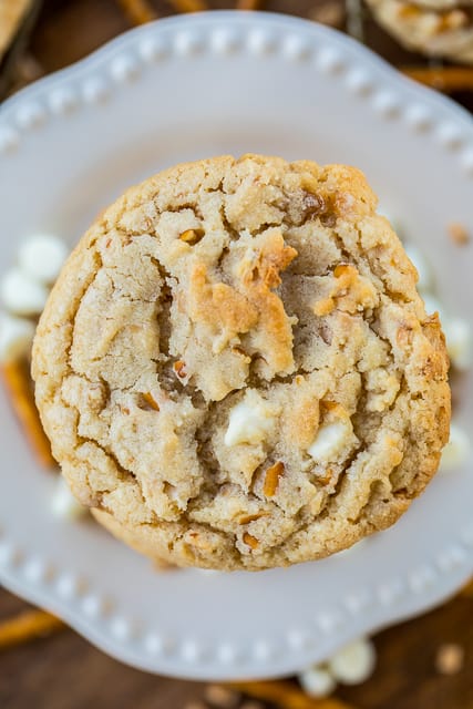 White Trash Cookies - cookies loaded with white chocolate chips, toffee bits and pretzels. Sweet & salty in every bite. Copycat recipe of my favorite cookie at a local bakery. These are DANGEROUSLY delicious! These cookies never last long in our house! #cookies #whitechocolate #chocolatechipcookies