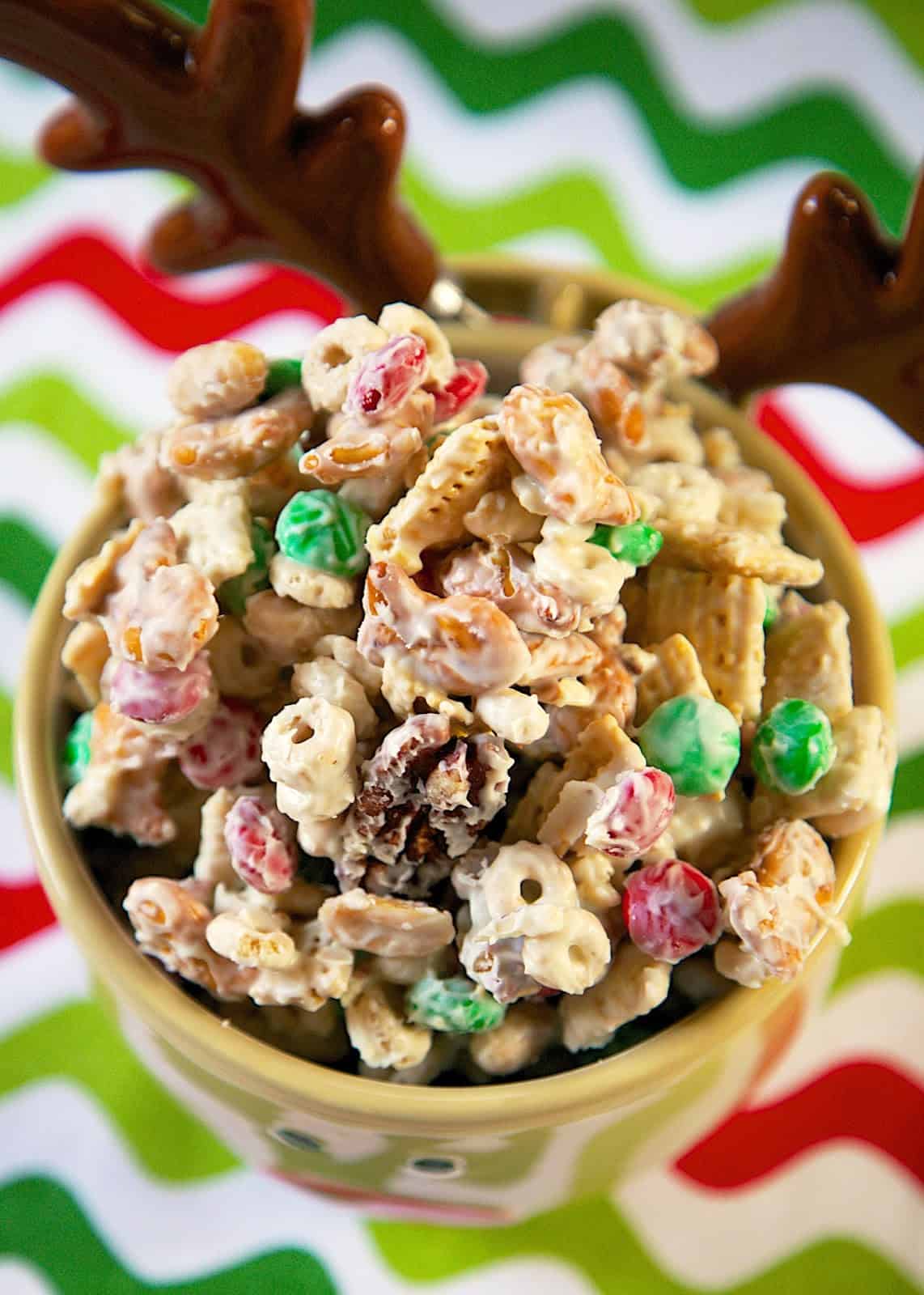 Alton Brown's White Trash Mix - white chocolate chex mix - HIGHLY addictive! Makes great neighbor or co-worker gifts. Chex, mixed nuts, cheerios, m&m candies, pretzels and white chocolate. A must for your holiday dessert tray! Everyone loves this no-bake holiday dessert recipe!