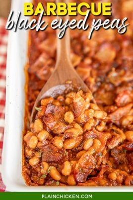 scooping baked beans from baking dish