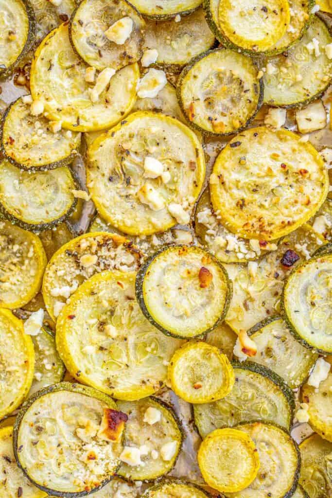 Baked Greek Squash and Feta Recipe - simple side dish that tastes delicious! Ready for the oven in minutes. Great with grilled chicken, pork, steak and even pasta! Yellow squash, zucchini, olive oil, Greek seasoning and feta. We make this all the time! YUM! #vegetables #squash #sidedish 