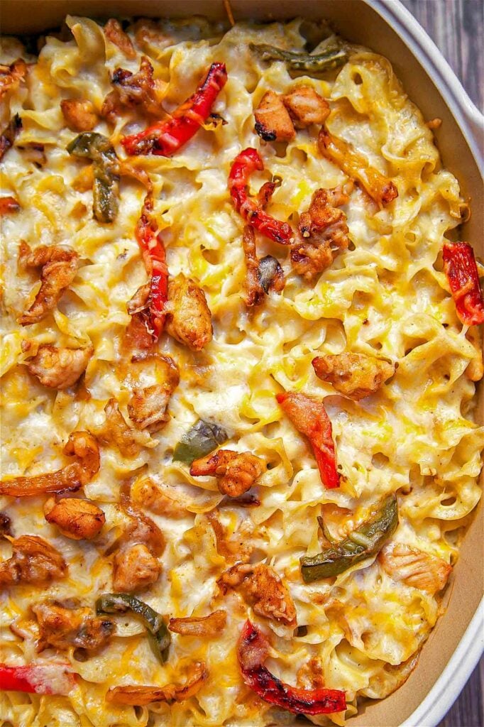 Chicken Fajita Noodle Casserole - chicken, fajita seasoning, bell peppers, onions, noodles, sour cream, cream of chicken soup and cheese. Seriously delicious! Can make ahead of time and refrigerate or freeze for later. Makes a lot - can split between 2 pans and freeze one for later. Everyone loves this casserole!