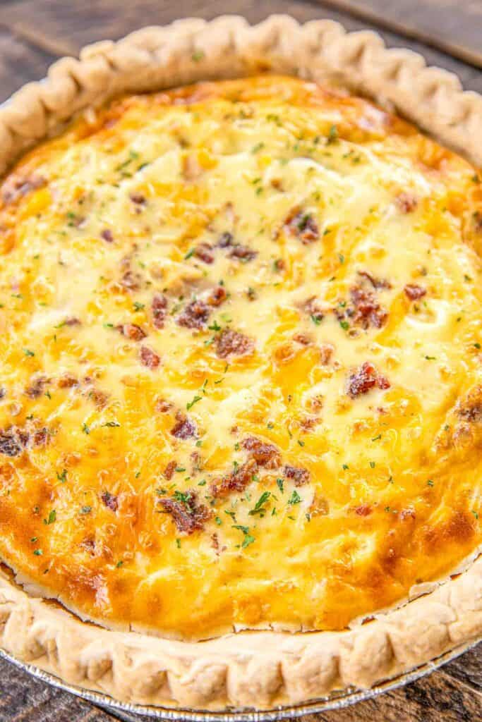 Crack Chicken Quiche - so quick and easy. Everyone LOVED this recipe!! Can make ahead and freeze for later. Pie crust, chicken, cheddar cheese, bacon, ranch dressing, heavy cream, and eggs Ready to eat in an hour. Great for breakfast, lunch or dinner. THE BEST!