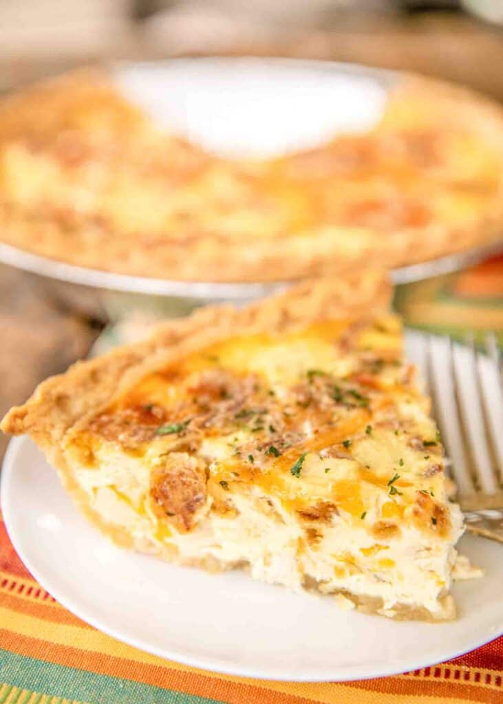 French Onion Chicken Quiche - seriously delicious! Chicken, french onion dip, cheddar cheese, french fried onions, eggs, and heavy cream. Can make ahead and freeze for later! Everyone LOVES the flavors in this yummy quiche!! I usually double the recipe and still don't have any leftovers! Just add a salad and dinner is done! #chicken #casserole #quiche #brunch #chickenrecipe