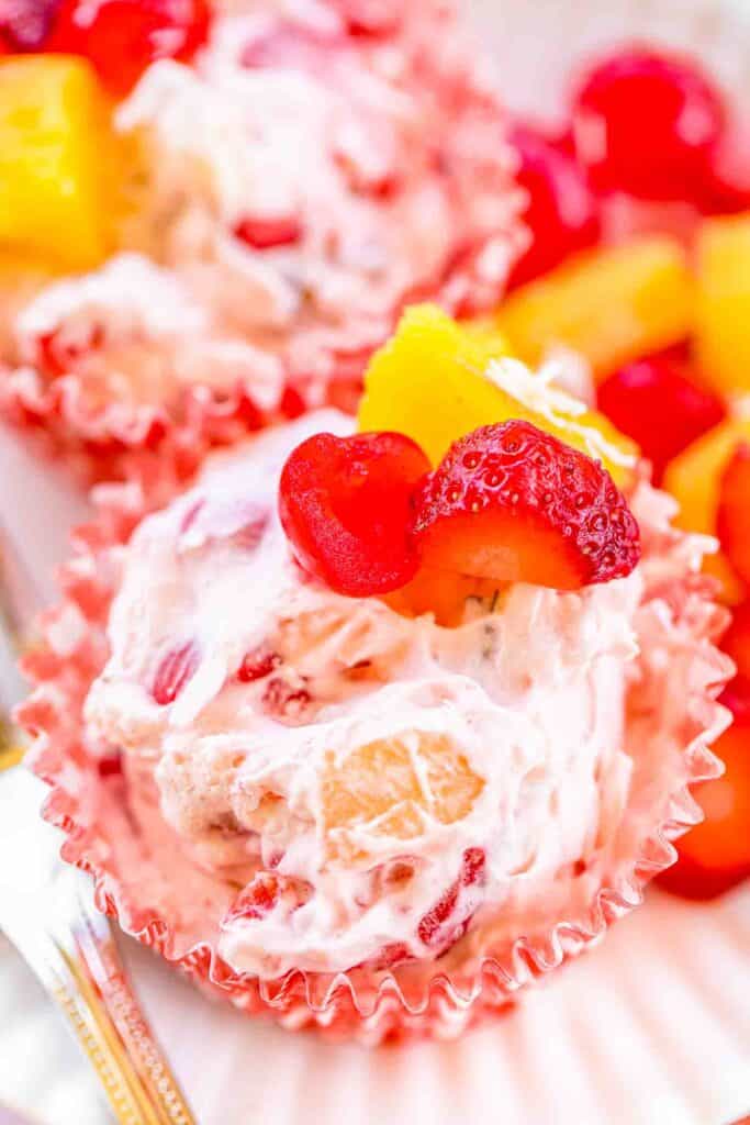 Frozen Fruit Salad - easy and delicious dessert!!! Cream cheese, cool whip, cherries, pineapple, strawberries, coconut and pecans. Make ahead of time and keep frozen until ready to serve. Great for all your summer cookouts!! A great way to beat the heat this summer!! #dessert #fruit #fruitsalad #frozen