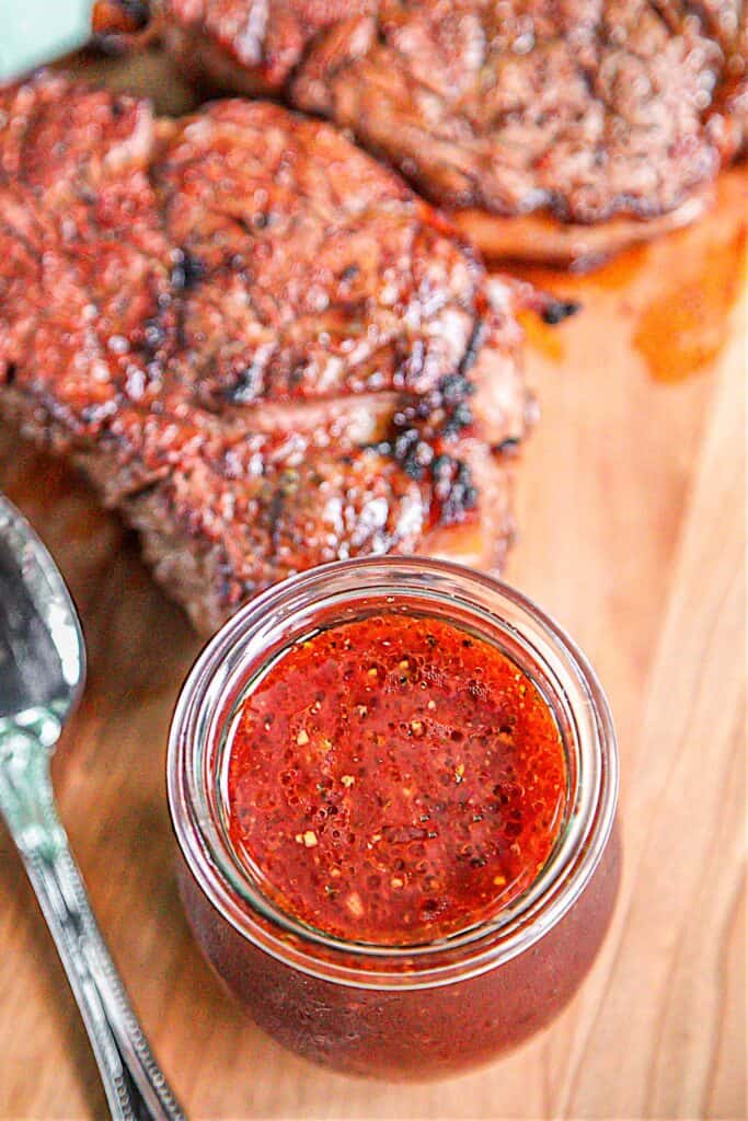Jack's Ultimate Steak Marinade - steaks marinated in red wine, chili sauce, red wine vinegar, Worcestershire sauce, onion, garlic, salt, pepper and a bay leaf. This marinade is seriously delicious! Our new go-to marinade. TONS of great flavor!!