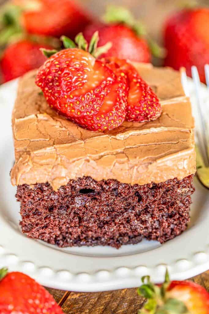 slice of chocolate cake topped with strawberries