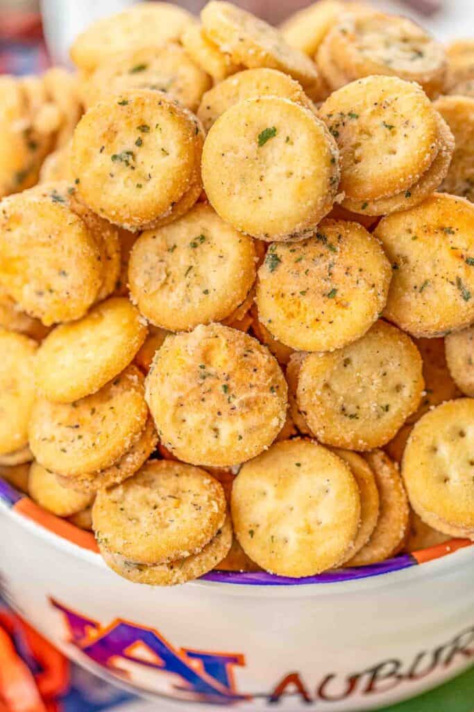 Cheesy Ranch Crackers - ritz bits tossed in a quick ranch mixture. SO good!!! Great for parties and in soups and chilis. We always have a bag in the pantry. Ritz Bits Cheese Sandwich Crackers, oil, Ranch mix, garlic powder. Can make in advance and store in an air-tight container. #tailgating #appetizer #ranch #cheese #partyfood