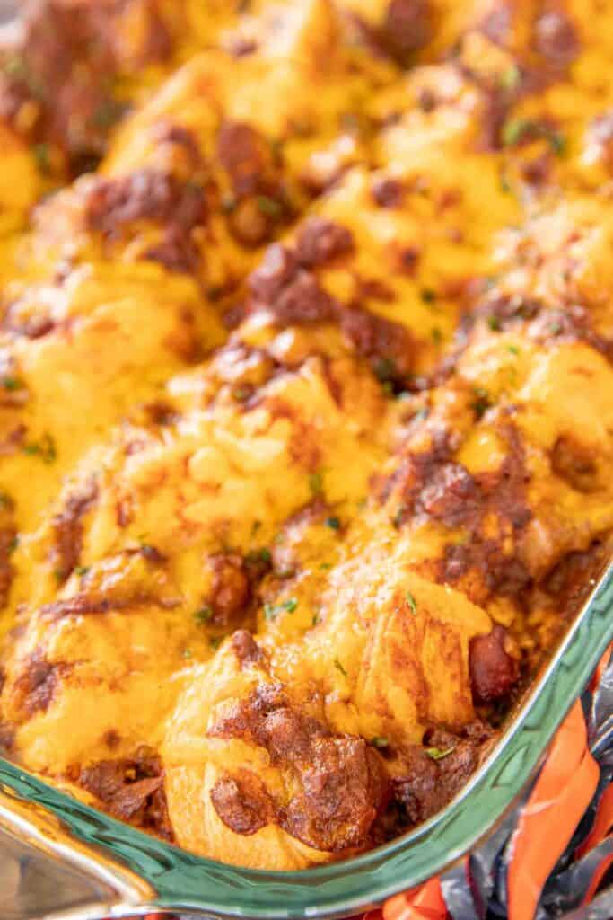 baking dish of chili cheese smothered pigs in a blanket